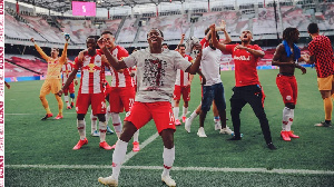 Majeed Ashimeru Celebrating With His Teammates