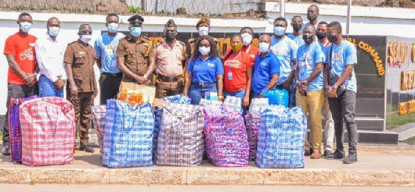 Representatives of the Secondi Prisons receiving the items