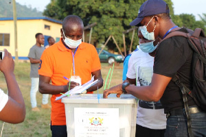 File photo of an official sealing the ballot box