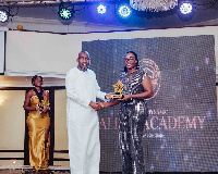 Alhaji Abdul Salam Mumuni (L) receiving his award