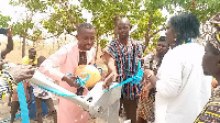 The Assemblyman together with the prophetess standing beside the newly acquired borehole