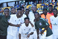 Players and coaches of the team celebrating their victory