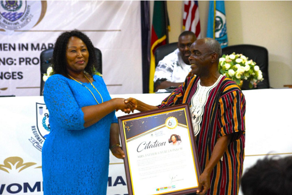 Esther Gyebi-Donkor receivingthe citation