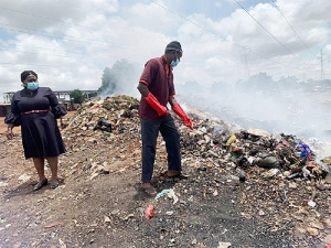 Mr Atsu clearing the dump after his arrest