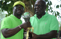 Omane Brenpong(L) receiving his prize from Sir Sam Jonah