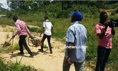 The Minister [in blue cap] ensuring the seized items are taken away