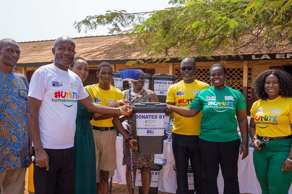 The Human Resources Manager of Vivo Energy Ghana, Mercy Amoah(right) presenting cleaning items