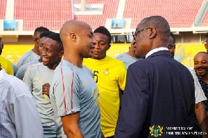 Dede Ayew interacting with the chairman of the Black Stars management committee KK Sarpong