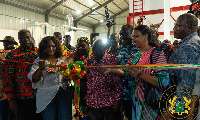 President Akufo-Addo cutting a tape at an event in the Ashanti Region