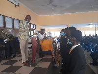 Mr Amoa-Awuah(left) performing  the induction ceremony 