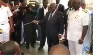 President Akufo-Addo with his conducting stick (baton), leading the band