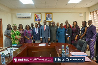 Members of the UniMAC Governing Council in a group photograph with Education Minister