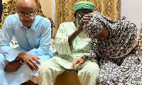 Andre Ayew and his daughter during the visit with National Chief Imam