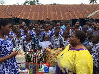 A representative of LAHC presenting the items to Good Shepherd Orphanage