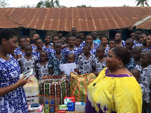 A representative of LAHC presenting the items to Good Shepherd Orphanage