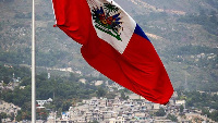 The Haitian flag waves over the Champ de Mars in Port-au-Prince, Haiti, on June 21, 2022