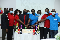 Management of Vivo Energy Ghana cutting the 10th anniversary cake