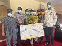 SRC executives of KTU presenting a cheque to the school's management