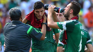 Mexico players take a cooling break during the 2014 World Cup in Brazil