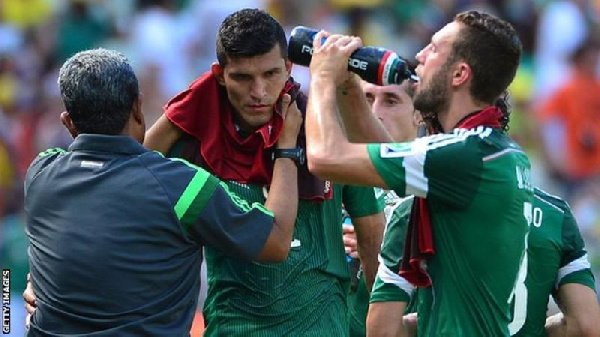 Mexico players take a cooling break during the 2014 World Cup in Brazil