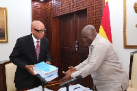 Emile Short presenting the Commission's report to President Akufo-Addo