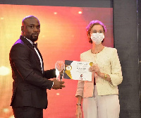 Mr. Nicholas Bortey receiving his plaque