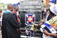 Rev. Daniel Nyarko and Rev. Emmanuel Awaitey Anneh and other members after unveiling the plaque