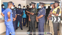 Dr George Akuffo Dampare and some officers at the health facility