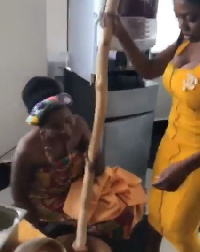 Nana Aba Annan showing her fufu pounding skills