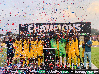 Ashgold players in jubilant mood as they lift the trophy