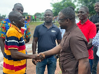 Fred Kyei Asamoah, right interacting with constituents