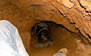 File: The abandoned galamsey pit had been turned into a play swimming pool for kids in the area