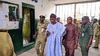 Nigeria's Minister of Interior, Rauf Aregbesola (in sky blue) at a prison facility | File photo