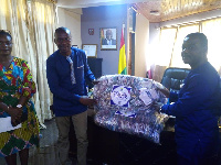 Management of CCTU presenting the items to the staff of Cape Coast Metropolitan Assembly