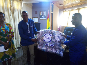 Management of CCTU presenting the items to the staff of Cape Coast Metropolitan Assembly