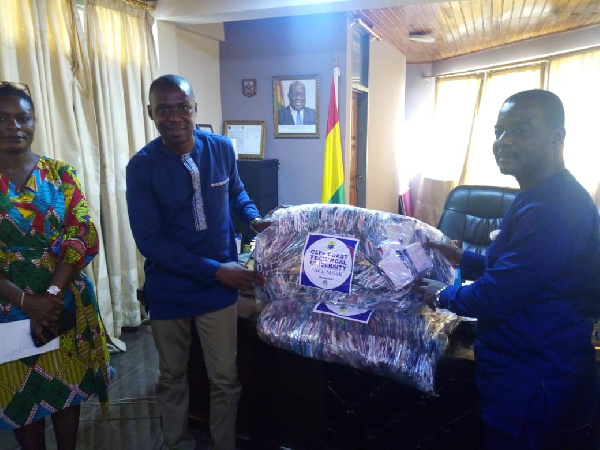 Management of CCTU presenting the items to the staff of Cape Coast Metropolitan Assembly