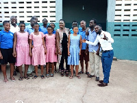 Maame Serwaah in a picture with some of the students of Akropong School for the Blind