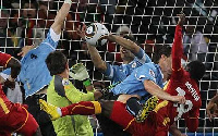 A photo depicting the Luis Suarez incident in 2010 World Cup against the Black Stars