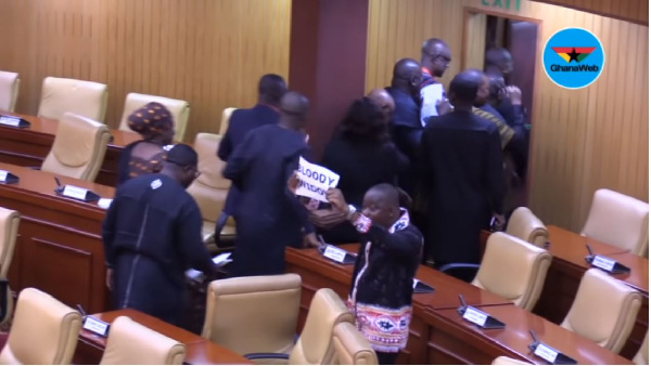 Minority members held papers with the inscription 'Bloody Widow' when walking out of Parliament