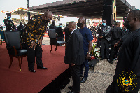 President Akufo-Addo interacting with John Dramani Mahama at the State funeral of Rawlings