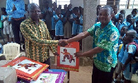 Mr. Anthony Amoah (R) presenting the books to Mr. Samuel Duame (L)