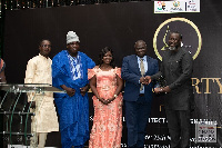 Samuel Quarshie and some staff at the awards night