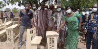 The Nakyiere family donating some furniture to Guo JHS