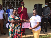 Some teachers being presented with certificate after a 3-day training on new curriculum