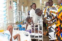 The Wenchimanhene interacting with a child-patient at the facility