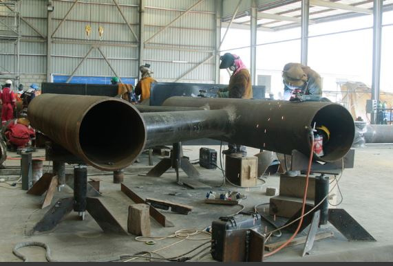 Welders busy at Fabrication yard of Seaweld Engineering in Ghana