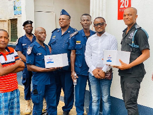 Ernest Egyir (in jeans) with representatives of the Saltpond Municipal Police