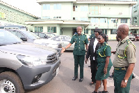 Mr. Kwame Asuah Takyi (First from left) inspecting the vehicles, accompanied by his three Deputies