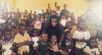 Edem and the children at the school