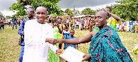 The District's overall Best Farmer, Simon Marfo receiving a certificate of recognition